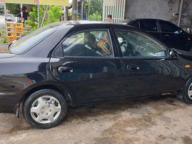 Bán Mazda 323 đời 2000, màu đen0