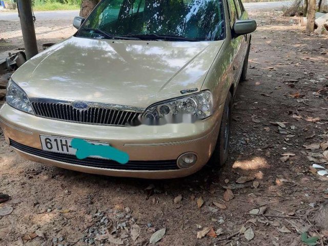 Cần bán xe Ford Laser đời 2002, màu vàng0