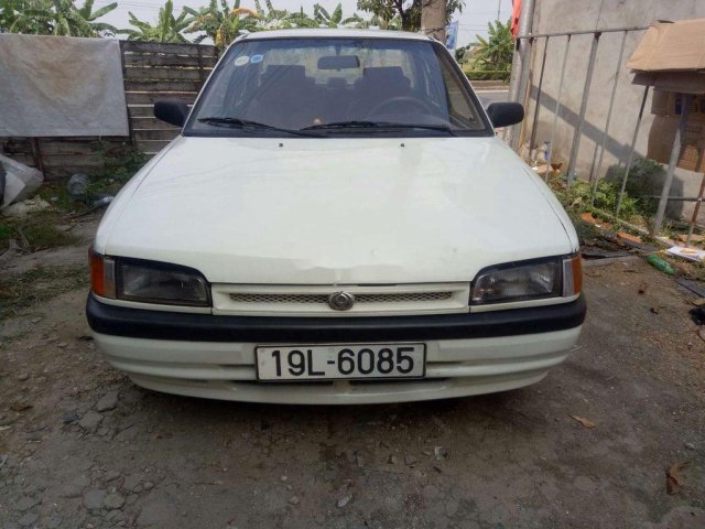 Cần bán gấp Mazda 323 sản xuất 1995, màu trắng0