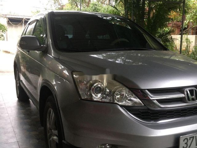 Bán Honda CR V năm 2010, màu bạc0