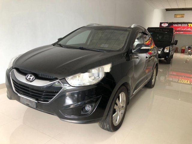 Bán xe Hyundai Tucson năm sản xuất 2011, màu đen, xe nhập số tự động0