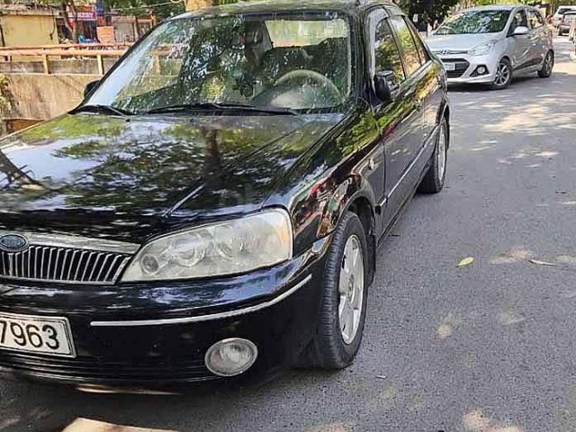 Cần bán Ford Laser năm 2003, màu đen còn mới0