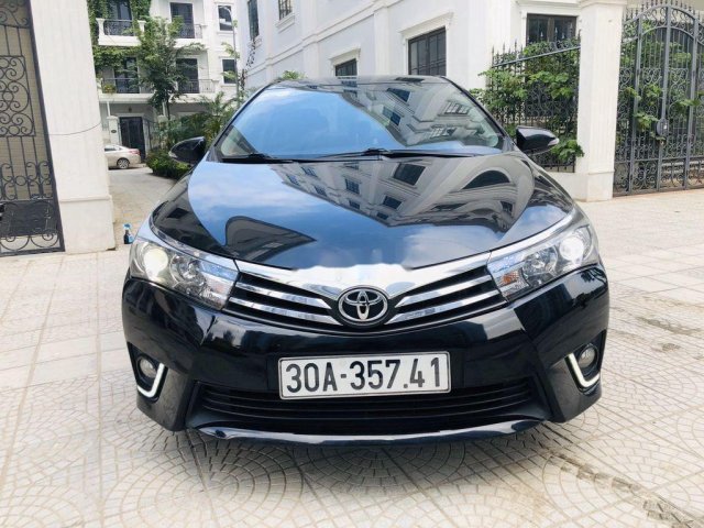 Cần bán gấp Toyota Corolla Altis 1.8G CVT đời 2015, màu đen chính chủ0