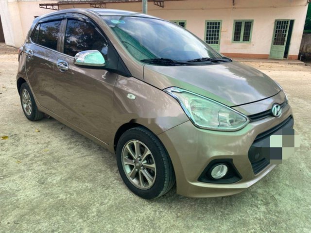 Cần bán lại xe Hyundai Grand i10 năm sản xuất 2014, màu nâu xe gia đình 0