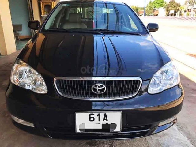 Cần bán Toyota Corolla Altis đời 2004, màu đen chính chủ, giá tốt0