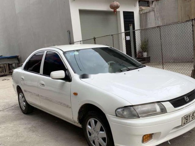 Cần bán xe Mazda 323 sản xuất năm 2000, màu trắng chính chủ0