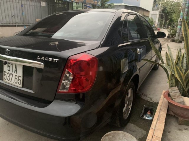 Cần bán gấp Daewoo Lacetti sản xuất năm 2010, màu đen0