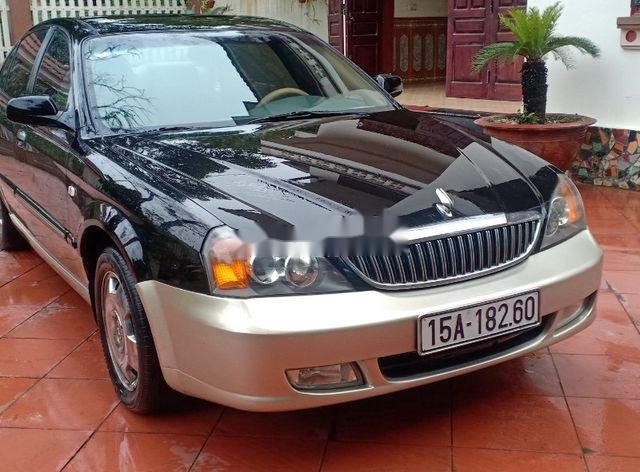 Cần bán lại xe Daewoo Magnus đời 2004, màu đen, 125tr