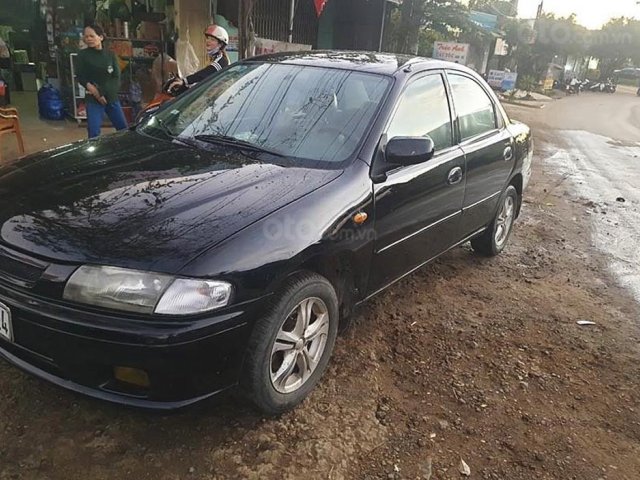 Cần bán xe Mazda 323 sản xuất năm 2000, màu đen, nhập khẩu còn mới