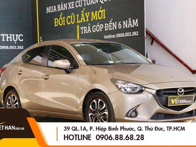 Bán ô tô Mazda 2 năm sản xuất 2016, màu vàng, 426 triệu0