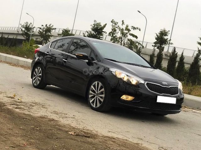 Cần bán lại xe Kia K3 2015, màu đen còn mới