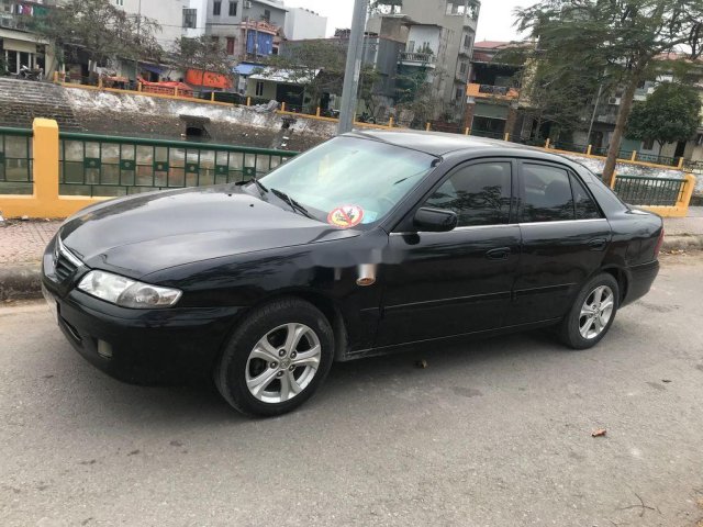 Cần bán gấp Mazda 626 đời 2001, màu đen chính chủ