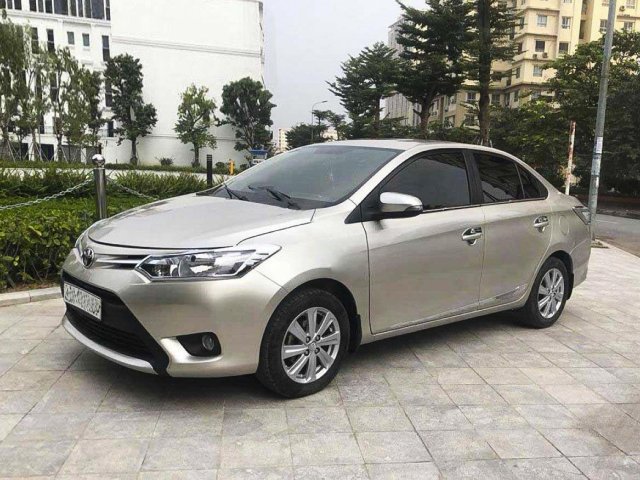 Bán Toyota Vios 1.5E sản xuất năm 2014, màu vàng cát0