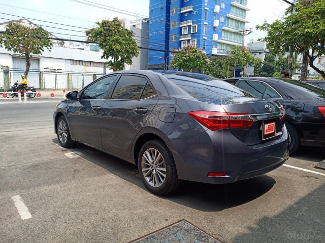 Cần bán Toyota Altis 1.8G 2015, màu ghi xanh0