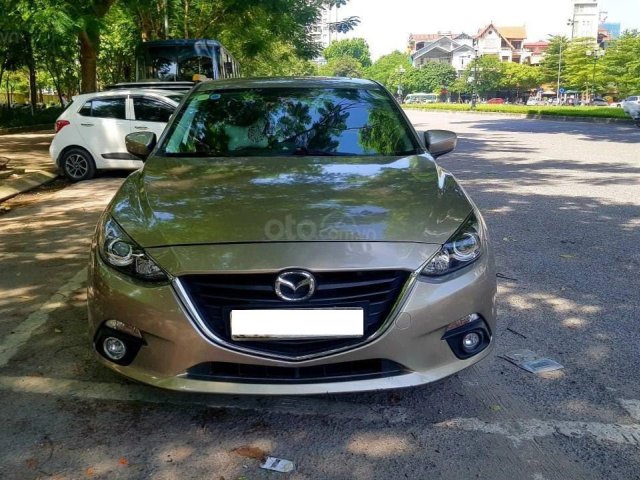 Cần bán Mazda 3 2016 bản 1.5AT màu vàng cát0