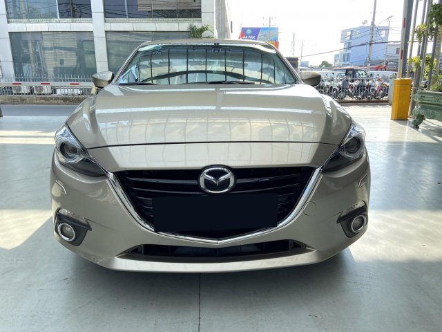 Bán xe Mazda 3 AT 2.0 2015, màu vàng