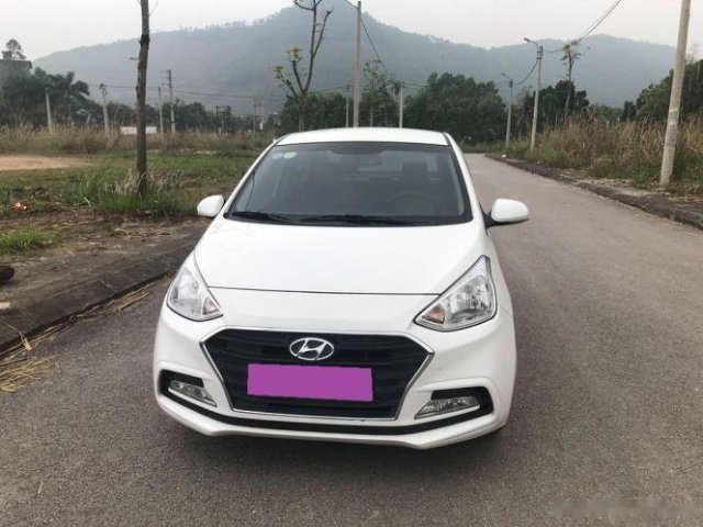 Cần bán lại xe Hyundai Grand i10 MT sản xuất năm 2019, màu trắng0