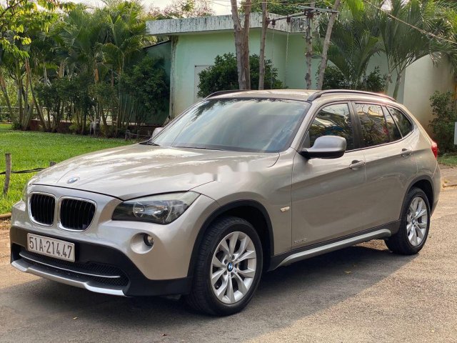 Bán xe BMW X1 2010, màu vàng cát