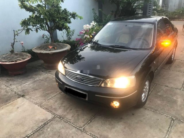 Cần bán gấp Ford Laser năm 2004, màu đen 0