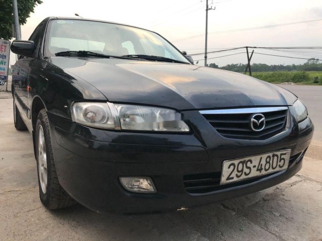 Cần bán xe Mazda 626 đời 2002, màu đen, giá 135tr0