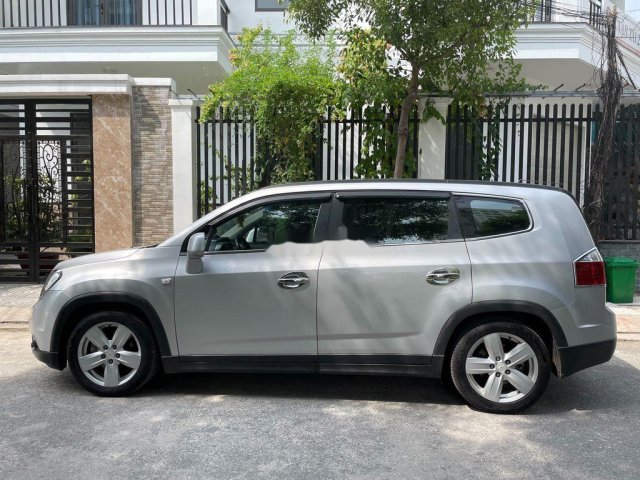 Cần bán lại xe Chevrolet Orlando 2012, màu bạc chính chủ0