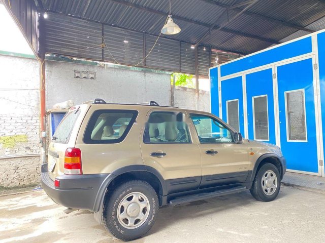 Cần bán lại xe Ford Escape sản xuất năm 2003, màu ghi vàng0