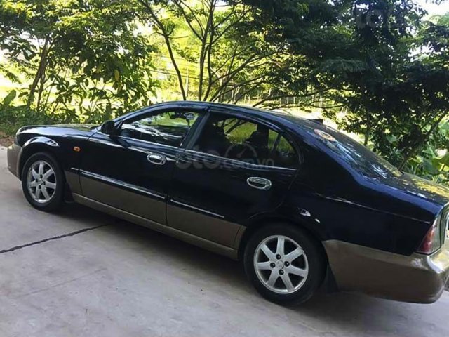 Cần bán xe Daewoo Magnus 2.0 MT đời 2002, màu đen  