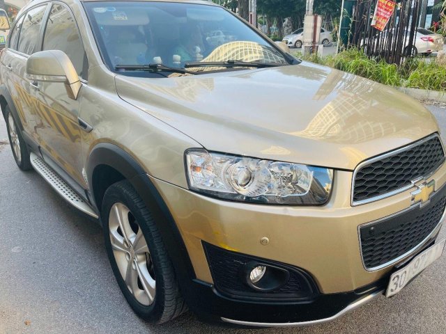 Cần bán xe Chevrolet Captiva đời 2015, màu vàng chính chủ0