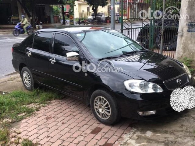 Cần bán gấp Toyota Corolla 2003 màu đen, giá tốt0