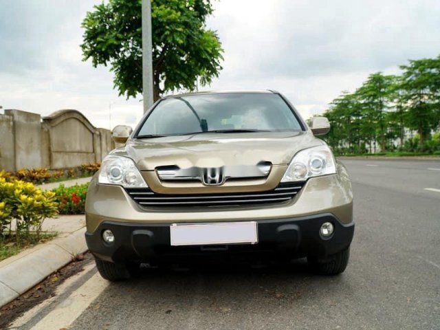 Cần bán gấp Honda CR V năm 2009, màu vàng cát0