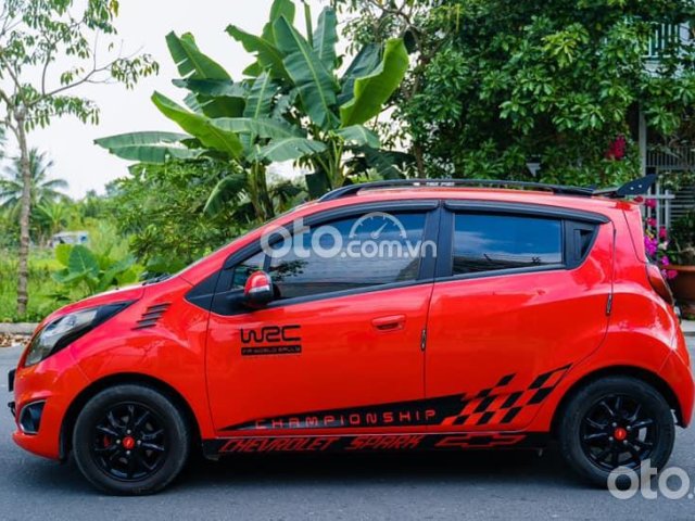 Cần bán lại xe Chevrolet Spark LT 2014, màu đỏ số tự động0