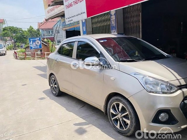 Bán xe Hyundai Grand i10 sản xuất 2015, màu vàng, nhập khẩu còn mới