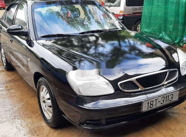 Cần bán gấp Daewoo Nubira đời 2002, màu đen0