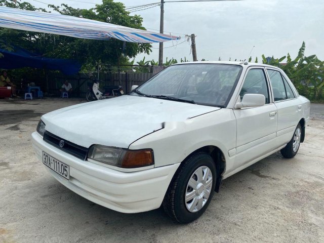 Cần bán xe Mazda 323 sản xuất 1995, màu trắng, xe nhập giá cạnh tranh0