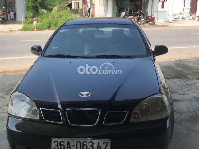 Cần bán Daewoo Lacetti năm sản xuất 2004, màu đen, giá tốt0