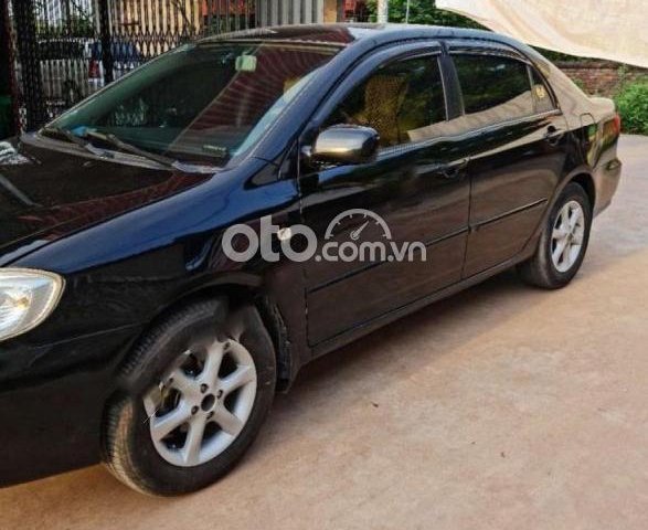 Cần bán gấp Toyota Corolla Altis 1.8G MT năm 2002, màu đen0