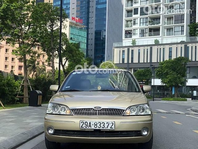 Cần bán xe Ford Laser GHIA 1.8 MT năm 2003, màu vàng cát, 128tr0