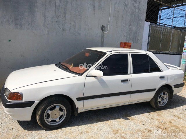 Cần bán xe Mazda 323F 1.6 MT sản xuất 1998, màu kem (be), nhập khẩu  