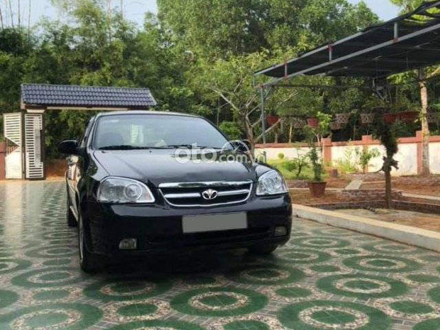 Cần bán gấp Daewoo Lacetti EX năm sản xuất 2011, màu đen0