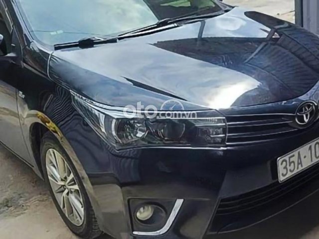 Cần bán xe Toyota Corolla Altis 1.8G MT sản xuất 2015, màu đen giá cạnh tranh0