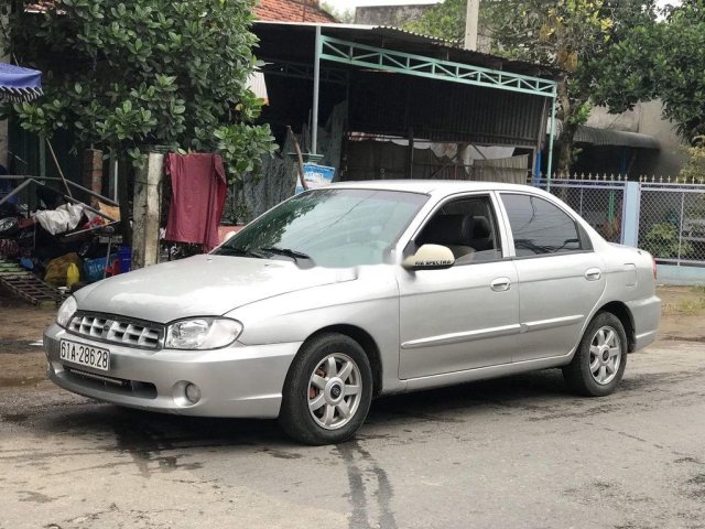 Cần bán gấp Kia Spectra đời 2004, màu bạc, 88tr0