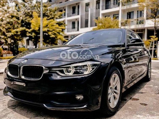 Cần bán BMW 320i đời 2016, màu đen, xe nhập0