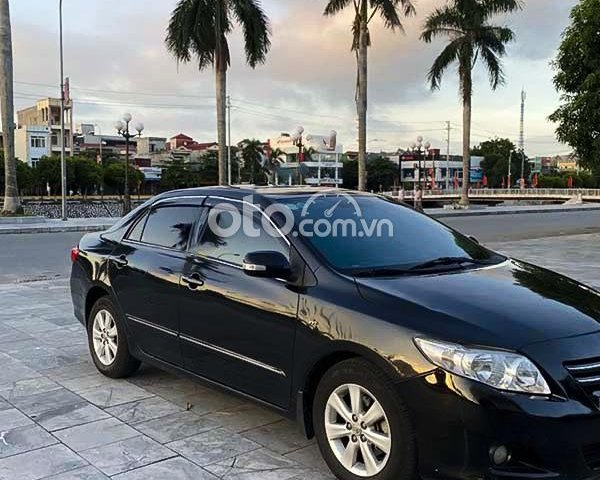 Cần bán Toyota Corolla Altis 1.8G AT đời 2010, màu đen còn mới0