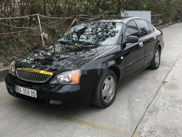 Cần bán lại xe Daewoo Magnus năm sản xuất 2003, màu đen, nhập khẩu số tự động0