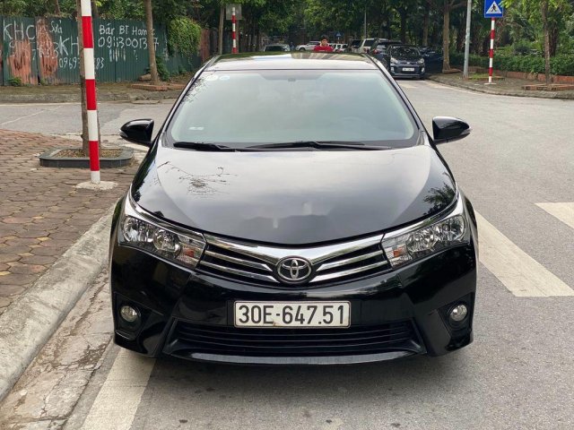 Cần bán lại xe Toyota Corolla Altis 1.8G đời 2016, màu đen0
