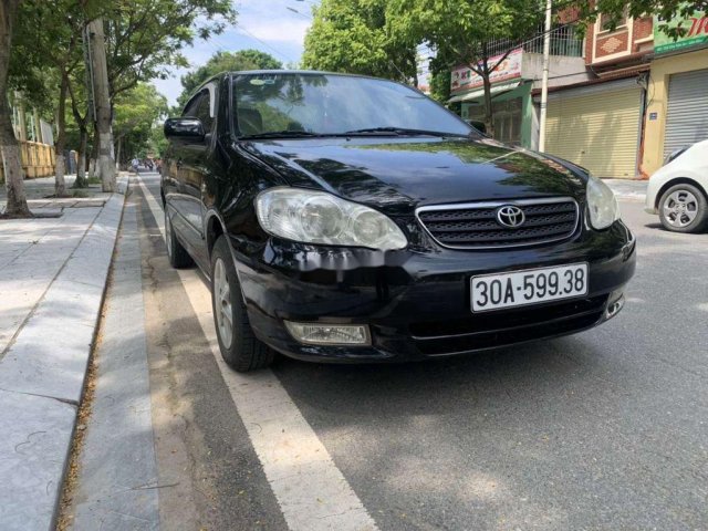 Cần bán Toyota Corolla năm 2003, màu đen còn mới, 145 triệu0