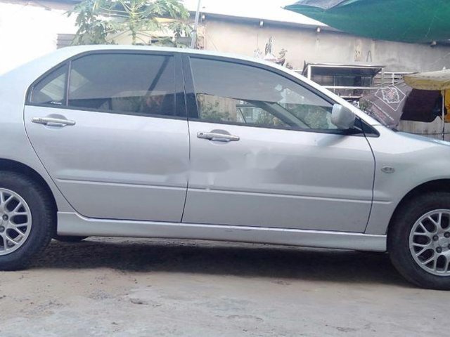 Cần bán xe Mitsubishi Lancer sản xuất năm 2004, màu bạc, nhập khẩu nguyên chiếc, giá chỉ 190 triệu