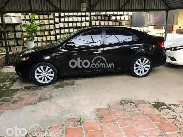 Cần bán xe Kia Forte SLi 1.6 AT đời 2009, màu đen, nhập khẩu nguyên chiếc  0