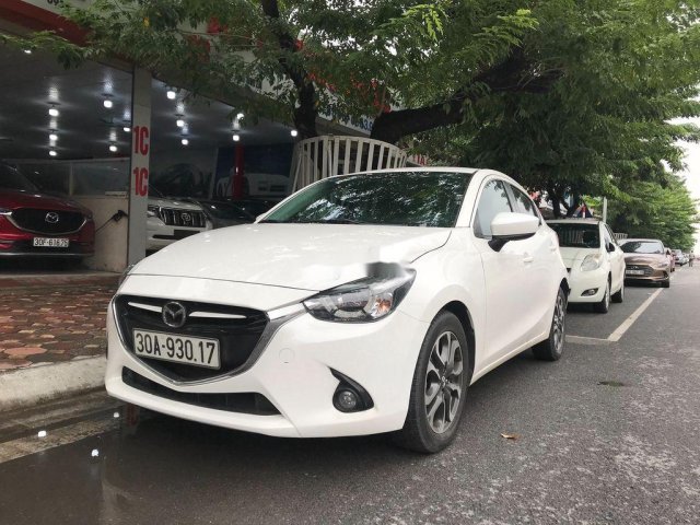 Cần bán xe Mazda 2 sản xuất 2015, màu trắng0