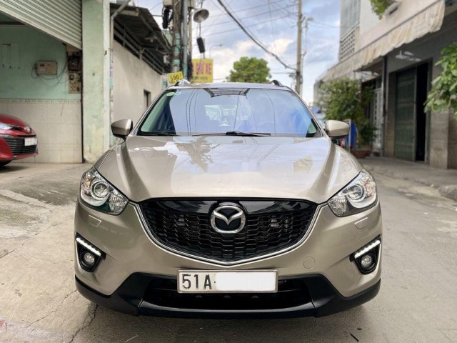 Cần bán xe Mazda CX 5 sản xuất năm 2013, màu vàng còn mới 0